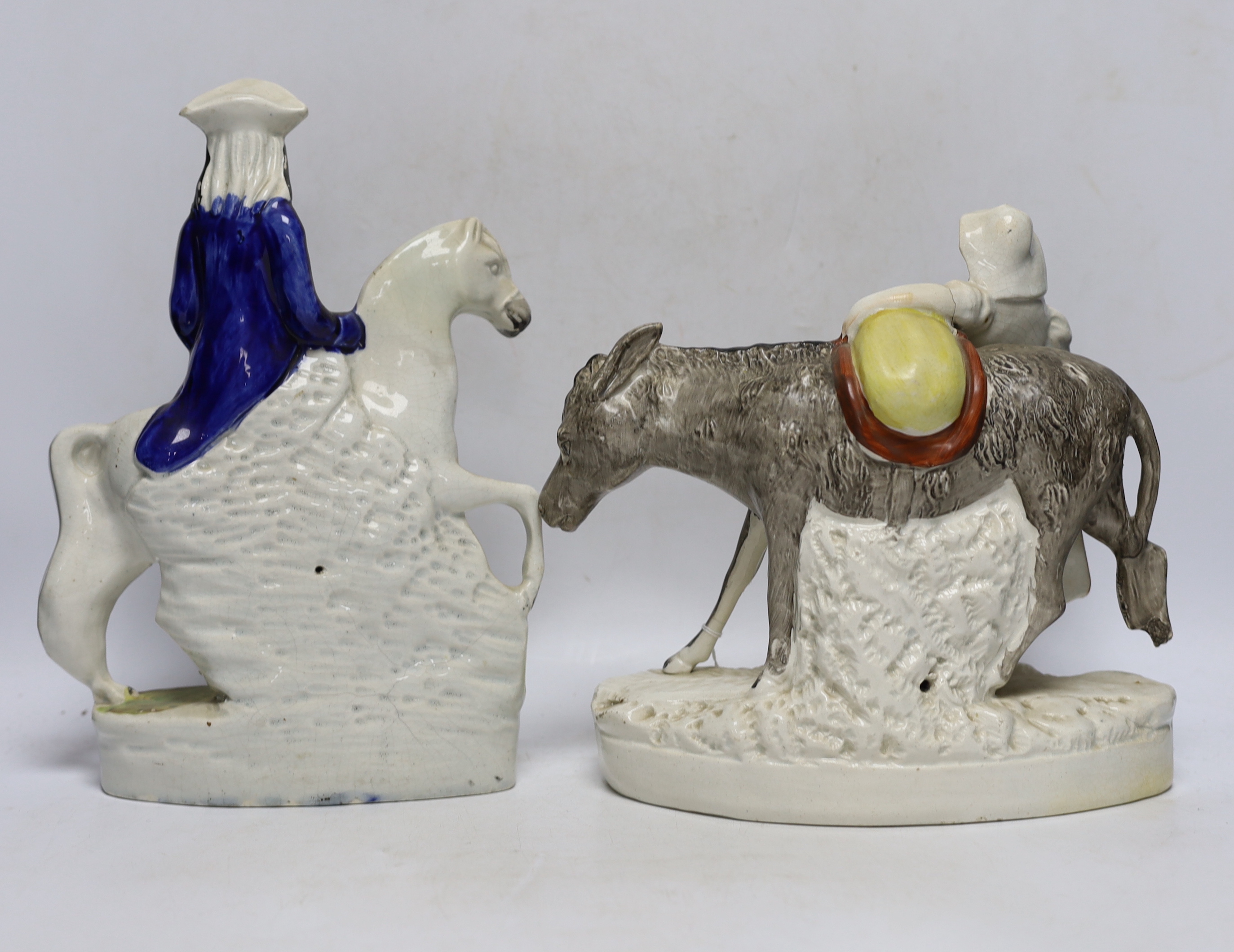 Three mid 19th century Staffordshire figure groups including Dick Turpin, Tom King and Sand, tallest 30cm